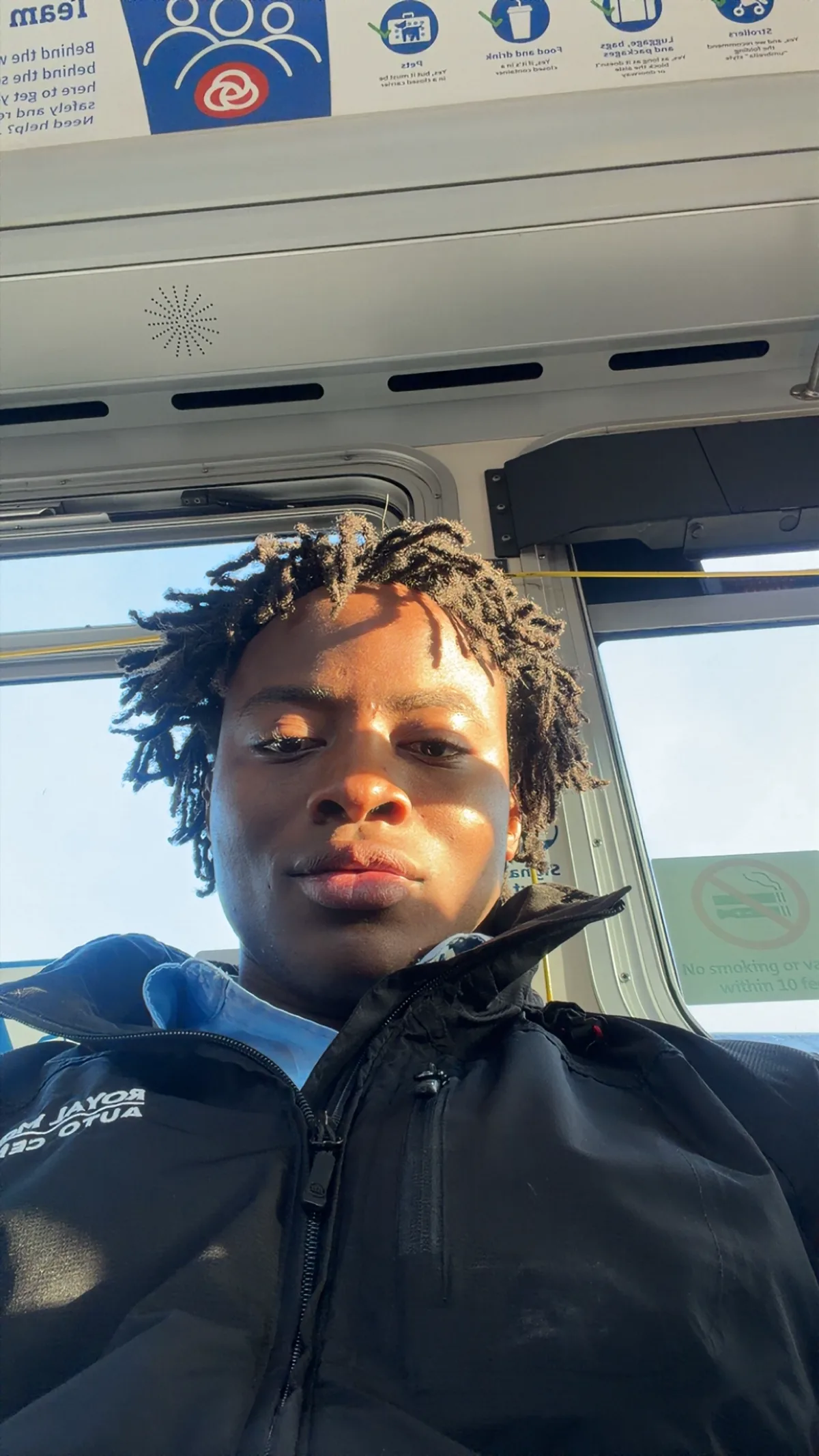 Artie Johnson on the bus heading to work in a Royal Moore jacket